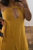 If you have a bigger cup size beware that this dress is slightly revealing. I'm 5'7, ordered a medium because it's a wrap around and the dress falls perfectly. It's super flattering on your waist and back side. The only issue was you can't adjust the key hole on the chest. When I tied the halter around my neck like normal, the opening was so large my chest was almost exposed and the fabric was jetting out. It doesn't open like on the model, it spreads apart. So I took the halter ties and literally had to wrap them around the middle portion to tighten it. Now it looks like twists. Still wearing it to a wedding though, everyone says it's okay. OH! And it does wrinkle super easily like everyone says, but that's rayon for you. - Jessica S.