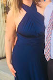 This dress lays nicely, and you can wrap it so many ways, I got a ton of compliments.  It is a little long but worked perfectly for me with 2 in heels. - Beth F.