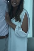 My sister had this dress in a medium, it fit my body great but it was too short on me. So I ordered the large and it was too big but the length was right. I ended up altering the side seams of the dress so it fit me a little tighter. It isn't see through at all, which was great. Sometimes I think white dresses will be too see through. - Taylor T.