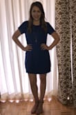 This is a very flattering shift dress! There's a second layer under the top layer, so the dress lays smooth. I wore it for a more casual graduation reception. It could definitely be dressed up or down. A size small probably would have worked for me, but the medium looked fine, so I decided to keep it. I don't think it runs too big though. I think I just ordered the wrong size! - Anna L.