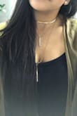 Let me tell you that I just love this layered choker necklace so much I bought it twice lol (and probably will buy it again if they keep it in stock). It's a beautiful piece, it makes you look elegant no matter what you are wearing, I wear it a lot to work and always have received compliments about it, what I love the most about it is that it's so simple, elegant, and kind of sexy at the same time. 
Now, I'll be honest: the reason I give it 4 stars and not 5 and why it's the second time I bought it is because of the material... although it last, the gold color fades and turns black over time and I wear this only in good conditions (aka places where it's AC on). Another thing I would fix about it and that drives me crazy every time i wear it is that all three layers are put together by only one "ring", so the necklace gets tangled every time. 
All that been said, I still love this necklace because it's one of those pieces that when you wear it, makes you feel extra... extra pretty, extra elegant, extra sexy :) - Ana P.