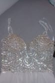 It's simple and flows nicely. The beaded top looks just like the pictures, and the built in bra fits perfect for a 34b. I love it! - MARIA C.