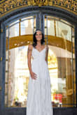 I bought this dress for my wedding and I absolutely love it. I did have to pay for alterations, which actually ended up being $180 for a $100 dress but it was well worth it. The top was a little see through and the slip that comes with the dress is laughingly short. But otherwise, I recommend this dress to anyone! - Kendra M.