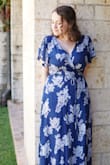 I bought this dress for graduation photos, and it was definitely a win! The material is lovely and comfortable, and the draping is just right. I have annoyingly large breasts (32 HH, this website doesn't even include the option), and the wrap style of this worked perfectly without any spillage or surprise flashes of boob. It was a tad long, but with heels not at all a problem. - Hannah H.