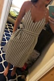This dress is so adorable. I'm really glad I decided to go with a small instead of a medium because it fits great. (bust area is a little loose, but if you tighten the adjustable straps it's fine) The waist feels a little loose without the sash tied, but the sash makes it perfect. It hits right below the knee, which is also perfect. The dress looks great with a sticky backless bra. So excited to wear it! - Kristen F.