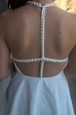 I absolutely LOVE this dress! It is so comfy, pearls are delicate, and has a great neckline. Very happy that it wasn't too short on me, and had enough material that you can't see your underwear, and can wear no bra! Definitely recommend getting this flattering dress! - Briana T.