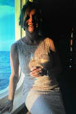 This dress it just beautiful. I ordered a size small first but it was too small at the chest, I returned it a got a medium. I had to get it fix , way too long for my 5'4".  I wore it on a formal night on the cruise ship and I had many compliments. No problems with the return. - Janine S.