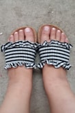 I have been looking for a cute pair of slides for summer and these looked perfect! They came exactly as pictured. I'm usually a size 6-6&1/2 and decided to size up to a 7 based on reviews.  However, I probably still could have gone with a 6. They're not too big that its a problem but my regular size probably just would have been a more snug fit. The 7's run a little big on me. Keep in mind the gingham material is pretty stretchy so your normal size might work for you! I have pretty wide and flat feet and these still feel pretty secure. - Lucy K.