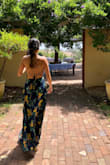 This dress is gorgeous. The fit is very flattering. I ordered a size M because of my larger cha chas, or I probably would have order a small. 32 DD. Can dress it up or dress it down. I wore mine wine tasting. - Jasmine