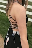 I absolutely love this dress. I got it a few weeks ago and have already worn it three times. I wore it to my cousin's wedding and senior brunch. It can be dressed up with heels or dresses down with jean jacket. The back is adjustable for comfortable. You don't need a bra but could wear a sticky one. - Alison V.