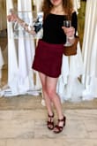 This skirt is so cute. I just ordered the beige one, too! The material is very soft, the skirt doesn't stretch but it doesn't really ride up or feel uncomfortable. I bought it with the shirt pictured, as well. Love it! - Jessie W.