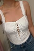 I love this bodysuit and it fits me so beautifully besides the fact that it bothers me a little when I bend in it. I have a longer torso so I wish it was a little longer. The material is this pretty linen however it doesn't really stretch so that's why I would consider sizing up. Also the white is a tad see through but nothing noticeable and it fits really nice braless. Overall don't think I would return it because it really does hug me so well especially if you are on the curvier side. - Jetzabel A.