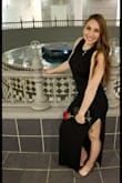 Wore this dress for my birthday! It was literally the perfect dress and I received so many compliments! This dress is extremely comfortable plus it has pockets! The slit on the side is high but that was one of my favorite parts of the dress! I would recommend ordering a bigger size, but I like my clothes to not be tight around my midsection! - Alexis T.