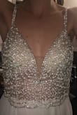 Waited forever for this dress to come in stock in my size. Absolutely beautiful! Pearls on dress are *Not White* but more a pearlescent color... I tried to show in pic (took with flash on) Need Small alterations and will be perfect for my wedding!! Xoxo - Ashleigh H.