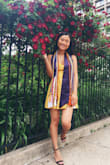 I wore this dress to graduation under a royal blue grad gown and the color looked so vibrant! Loved it. :) - Rou H.