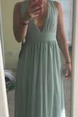 I love the color. It is a seafoam color. The dress is really good quality - 3 layers but tight around rib cage. - Madison D.