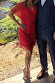 I purchased this dress to wear on my honeymoon. I originally ordered a small, which fit up top perfectly, but was too tight for my liking on the bottom. I sent it back and ordered the medium. After having minor alterations to take the shoulders up, it fit great! My fiancee loved this dress so much, I had to make it work! The color is vibrant and the dress was very comfortable after alterations. I have worn it to a wedding and will definitely be taking it on our honeymoon! - Daphney D.