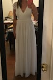 I am wearing this for my wedding on June 23rd! It is beautiful and the fabric is so soft. It runs long but I am tall and will wear heels so it's perfect.  It is a little tight in the waist and will show cleavage if you have a bigger chest.

It is very well-made and I am very happy with it. - Hannah G.