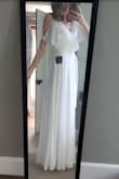 I was pleasantly surprised when the dress arrived, and I was able to feel the quality of the material.  It is not too thin, and has a silky layer underneath. You can adjust the tie around the waist if you need to tighten it. I am 5'10", and the bottom of the dress hovers above my feet perfectly. I am elated I was able to find this dress for this price on my first try!  I was dreading wedding dress shopping, and Lulus has made my life SO much easier! Thank you! - Corinne W.