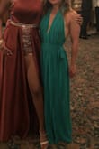 This dress is super flattering. It's pretty low cut by could definitely be sized up so there is more overlap in the chest area. - Aimee F.