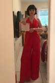 This jumpsuit is gorgeous!!! The color is brilliant. It is lined at the bottom and has pockets. It wasn't too long. I paired it with red heels. So many people commented on my outfit. I absolutely love this outfit. I felt so sexy in it. - Shannon W.