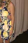 After reading the reviews, I was prepared for the low cut under the arms and was not expecting to be able to wear a bra with it. It came in the mail and it fit perfectly! The material is really nice, and I received so many compliments on it at the wedding I went to. Everything about it was just right, highly recommend this dress! - Lauren S.