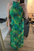 Beautiful fabric and I love the high cut on this. It does fit a bit awkwardly around the bust/waist though and isn't very fitted. It sort of buldges out around the bust if you cinch the waist too much. (Or doesn't lay flat against the waist uncinched)

The length just hits the ground (I'm 5'9") - Leah M.