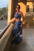 My waist /stomach are my LEAST favorite parts of my body , so to show my mid-drift is not anything I'd ever considered as an option before . Plus I'm not a young 20's something. I figured I'd take a chance on this outfit for a girls trip to Mexico.  There in the humid tropical weather, where everyone wears beach attire,  I could be daring and wear something out I would never feel comfortable wearing at home .  
 Well, not only did I feel sexy, I had multiple women from young to older out of no wear coming up to me at the buffet outdoor dinner, asking me where I'd bought my dress and how great it looked on me. I felt young ,stylish, trendy but classy.....not like I'd gone too over the top for my age (43, bty). The dress is high waisted....so hides lower tummy....and the top, cinched tightly, went to about my last rib.  I have a very long torso, however.

Cons of this outfit: no way can you wear a bra. Even a backless strapless bra shows.  If you have boobs that don't need support, all is good as nips aren't obvious, but this top can't be worn with anything other than boob sticker bras....a joke if you have 32DDD like me. Best to embrace slight sagging and go with it. The top does get loser as you move around, but it's an adjustable tie top with string ties in the back so I wasn't surprised. All in all, it's a winner. - Christine H.