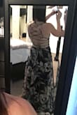 A friend told me to order a size up so I ordered a Medium instead of a Small and it fit perfect. I knew it was going to be a little long but I was okay with it. I would recommend this dress. - Daryl S.