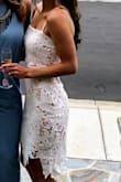 This dress was a huge hit at my bridal shower. It fits perfectly, not too loose or too tight, and there's not much stretch to the fabric. Perfect length, too. Love! - Mary F.