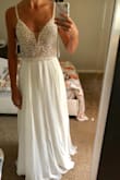 Thank you, Lulus!! All the other reviews were right when they said that pictures really don't do this dress justice! It is stunning on and looks so much more expensive than $250. I was a little nervous about the rhinestones looking chancy but the beading is actually beautifully done in scallops that will look perfect for our beach vows. The straps are a perfect length and the built in bra fits really well - I wouldn't want to change a thing! There's a little extra room around my rib cage but the actually waist of the dress (where the zipper stops in the back) fits great so I know it's the perfect size! I think the looseness of the rib cage area is mostly due to the style of dress/open back vs actually being "too big". The only alterations needed will be to take a few inches of length off since I want to be in sandals or barefoot. If I were going to wear a small heal/wedge shoe, no alterations would be needed. - Madeline B.