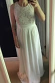 This dress is absolutely gorgeous in person. Photos do not do it Justice which is actually the reason I chose to return it and purchase my 3rd and final wedding dress option from Lulus! I wanted something I felt good and looked good in. For me, the photos just don't do it and I was looking for a wedding dress level of wow. Still rating it 5/5 because after seeing it in person I can't rate it any less! It's beautiful. - KRISTIN L.