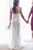Wore this for my small beach wedding in May. It was absolutely perfect! I had it taken in and hemmed and also added a very simple belt that I found on Amazon. Turned out to be a perfect dress and you can't beat the price! People were amazed I only spent a little over $100. I'm 5'4", 132 lbs, 34 DD chest and ordered a small. I had my seamstress leave a small "puddle" train when hemming which made the dress even more beautiful. She was able to add a bustle as well. - Nicki C.