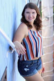 I love this top! It's flowy and comfortable and really light fabric. I wore it just with breast petals and it was great! The bright colors are so fun and perfect for spring and summer. I wore it to the beach for my senior pictures and I couldn't be happier with how they turned out! - Kami C.