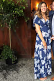 I wore this dress to a spring wedding while 6 months pregnant.  I was a little apprehensive purchasing my normal size small, but this style dress fit my growing bump perfectly!  I think I should be able to wear it when I'm no longer pregnant, too, since I'll be able to just tie it tighter.  Some of the reviewers said it was difficult to tie, but I found it to be very easy!

The dress was a thinner material, but did not seem cheap.  It was flowy, very comfortable, I loved the print, and it was a beautiful blue.  The length of the dress was perfect with heels (the 4" Taylor natural suede ankle strap heels, also from Lulus), and although it was a little long when I changed into flats later on in the night, it wasn't bothersome.  

I got ton of compliments on this dress all night long, and would definitely it recommend to anyone (pregnant or not)! - Erin M.