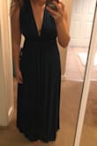 The material of the dress is stretchy and super comfortable. I tried it on a few ways and it's cute in all the ways I tried. I plan on wearing it for a bridesmaid dress this summer. I can never tell if I'll be a small or a medium in things... I ordered in a small and it was great. - Lucianna W.