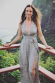 This dress is simply stunning!! I wore this dress on vacation for my anniversary and it was perfect! True to size and you can make it a perfect fit depending on how you tie it. I felt supported the entire night, but may want to consider dress tape if you're worried about coverage. I felt elegant yet sexy at the same time. I highly recommend this dress! - Kristin Z.