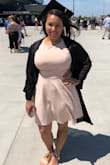 Great dress! Wore it for my graduation. I got a large based on the size measurements and it fit perfect around the waist and had a little stretch to it to accommodate the boobs (36 DD). It did accentuate the girls a little which I wasn't exactly going for but it was still pretty. Also, nude undergarments are necessary! It's not completely see through, but I chose the blush color and you can see dark or patterned underwear through. I gave it four stars because I feel the material could have been a little thicker but besides that I had no issues. - Kimberly D.