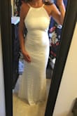 I ordered a handful of dresses from Lulu's as potential elopement dresses and this is the one I decided to keep. It's absolutely beautiful and such a classic, timeless style. The fit is perfect - not too tight or loose and was very comfortable on. While it is quite fitted throughout, the material did a great job of hiding any imperfections. Very happy with my purchase! - Olivia M.
