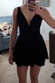 The romper runs small, especially in the waist, so I would go a size up. You can feel and see where the shorts are sewn to the dress in the waist, but perhaps this would not be noticeable if I had ordered a size medium. The fabric is similar to a swimsuit, elastic and thick. I also think the skirt is a little too wide and too short, so the proportions are not quite right for me. - Gracieli