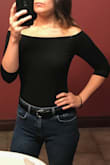 I love this top: it's tight and stays in place. The neck is wide but doesn't go below the shoulders, which makes it versatile in my opinion. I've worn this to work and also out to dinner with my boyfriend. It looks great tucked into a pair of pants/shorts or a skirt! The fabric is very stretchy and breathable as well. - Brittany D.