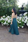Best purchase ever! I bought this dress for a wedding I attended in May. The dress fit is very flattering and I love how it fitted around my waist. I got many compliments from family and friends. The back of the dress is very strappy, so definitely have someone help you out with getting the straps fitted. If you are in the shorter side, it will very long, so I would recommend on getting it altered. I wore 5 inch high heel, so it worked out in the end. Overall, a lovely dress and definitely a worthy purchase! - Carina V.