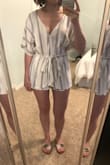 Fabric is very high quality and I love the fit, especially the length. Even though I'm not very tall it can be hard to find rompers that are long enough. I added a snap so it doesn't fall open and show my bra. I'm sure a tailor would do this for cheap or you could go without a bra. - Caroline P.