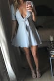 I love this dress. Perfect dress you can dress up or down. It is low cut and looks cuter without a bra but I'm a big fan of low v neckline so I love it. The blue is a really pretty blue and the material is nice. - Lauren A.