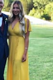 I wore this in yellow to a wedding earlier this month and received so many compliments. Fit is perfect and not too low cut/revealing where I had to be worried. My only complaint is that even though there is a liner on the bottom half of the dress the top is not lined. I would recommend some skin colored sticky boobs or pasties or else you will be able to see through, as the material is thin. - Ashlyn S.