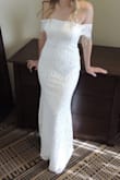 Wore this dress as my wedding dress and received compliments all night. The sleeves are a bit restricting but nothing that was too uncomfortable. I was able to dance all night and the dress never moved like some strapless dresses do. It's great quality for such a low price. Loved it! - Marissa S.