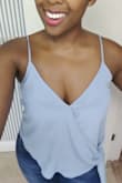 I own this shirt in three colors now! It fits so perfect. I received so many compliments. Absolutely love it.....p.s. the button does open at the top if you have bigger boobs so get a size to fit ya boobs. I have small waist and about 36D and I wear a large. Normally a medium in tops. - Dominique L.