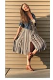 I absolutely love this dress! It is fun and flirty! I ordered a medium but I really should've ordered a small...my mistake though! I paired it up with a cute bralette I have and no one notices a thing! - Ashley T.