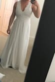 Usually a size 8, ordered a M and couldn't zip up the back all the way. Loved the back! And the side. Front made my shoulders look broad but they are a little broad anyways. It's cute! Nice and long that's for sure. I also liked the slit. - Jordan B.