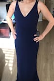 I bought this dress for my bridesmaid in navy and the medium fits her perfectly! The length is perfect with heels. It's form fitting yet very flattering. I would definitely purchase it for myself in other colors for fancy events! - Jennifer P.